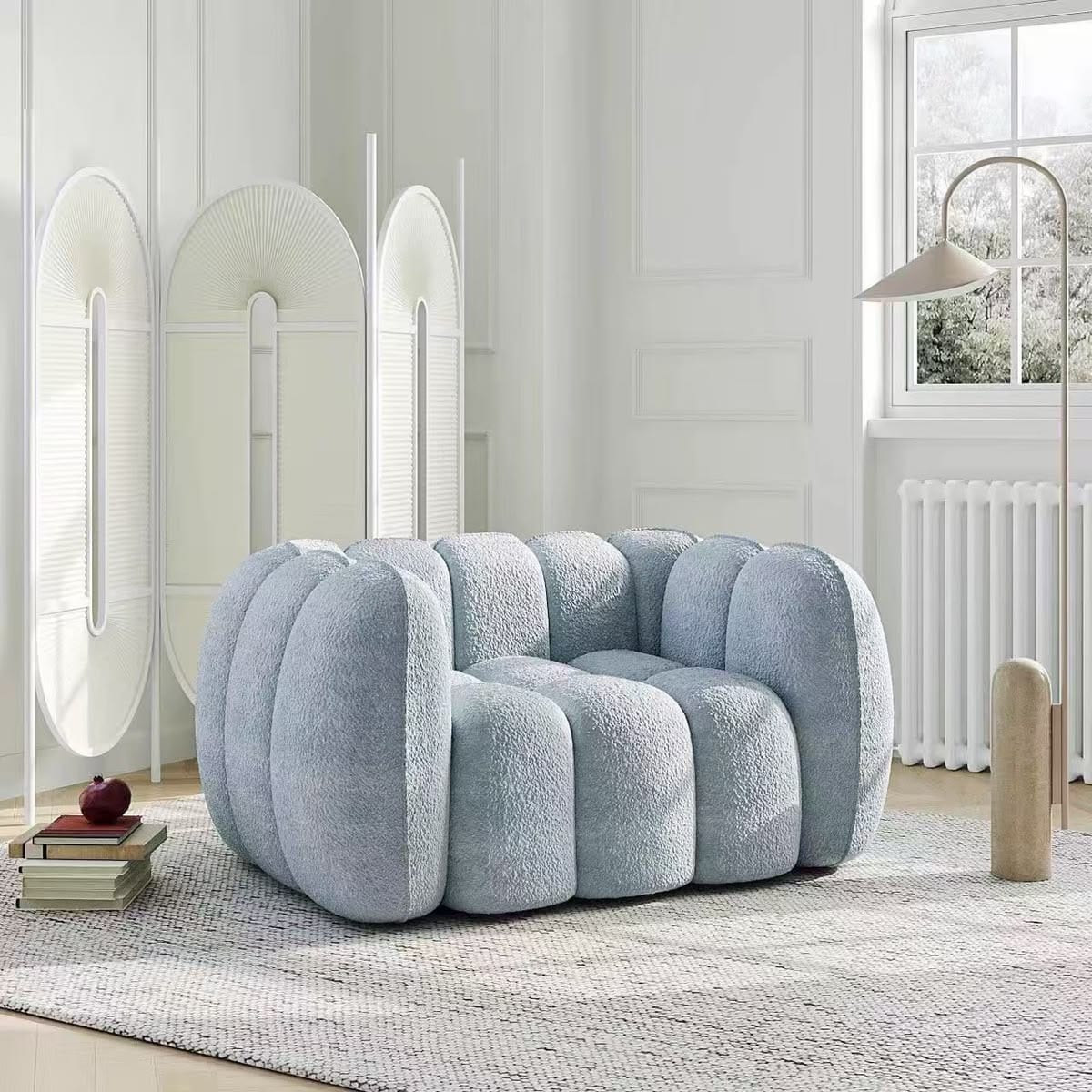 Puffy channel-tufted armchair in light blue bouclé